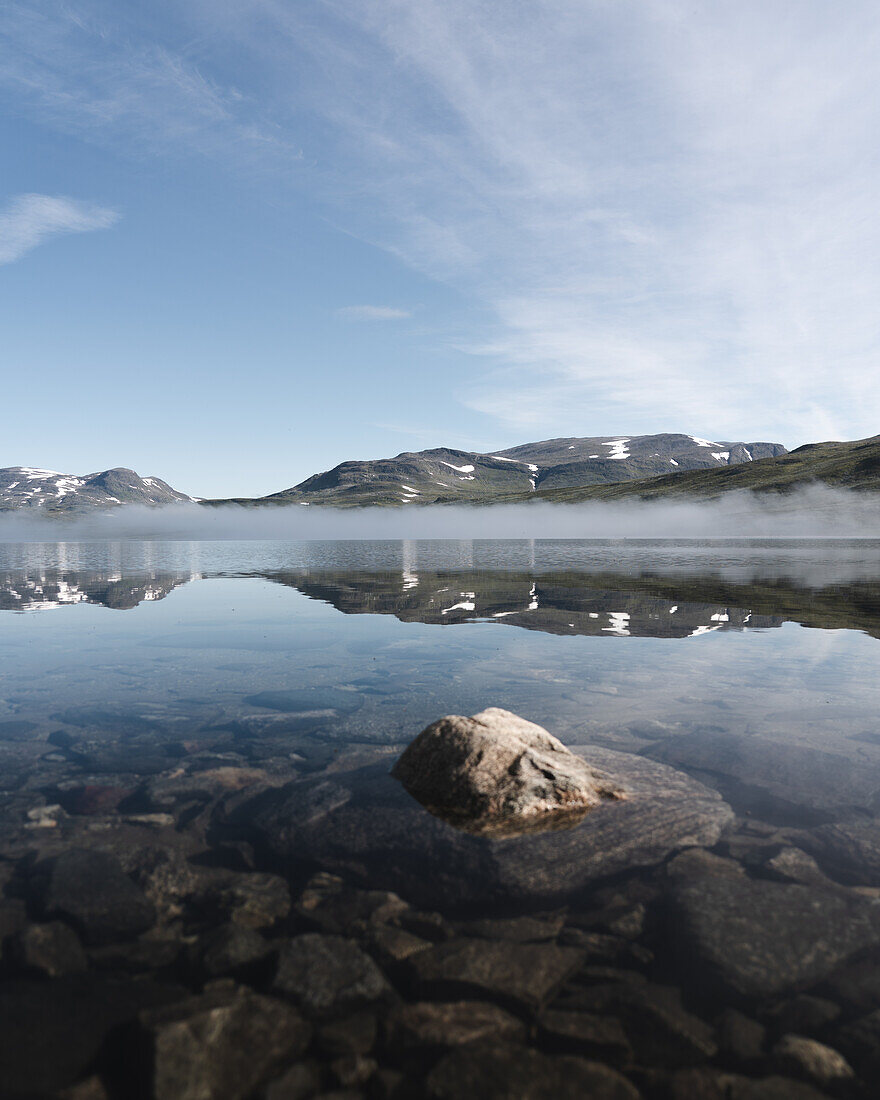 Reflection in the mountain lake in the morning, Norway