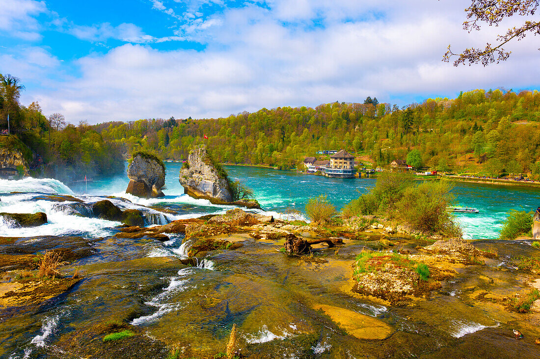 Rhine Falls and Swiss Flag at Neuhausen in Schaffhausen, Switzerland.