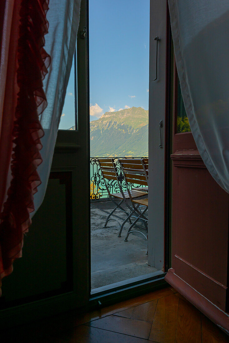 Balcony View from The Historical Grandhotel Giessbach with View over Mountain and Lake Brienz with Sunlight in Bern Canton, Switzerland.