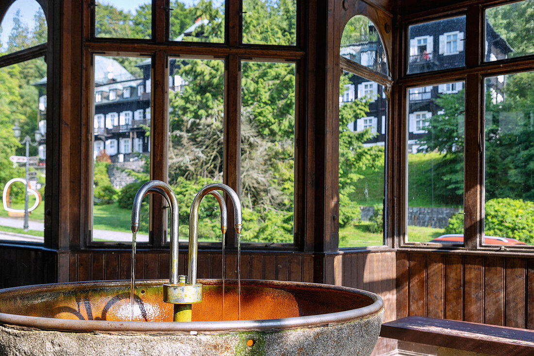 Healing water fountain in the drinking hall in the spa town of Karlova Studánka in the Jeseníky Mountains in Moravia-Silesia in the Czech Republic