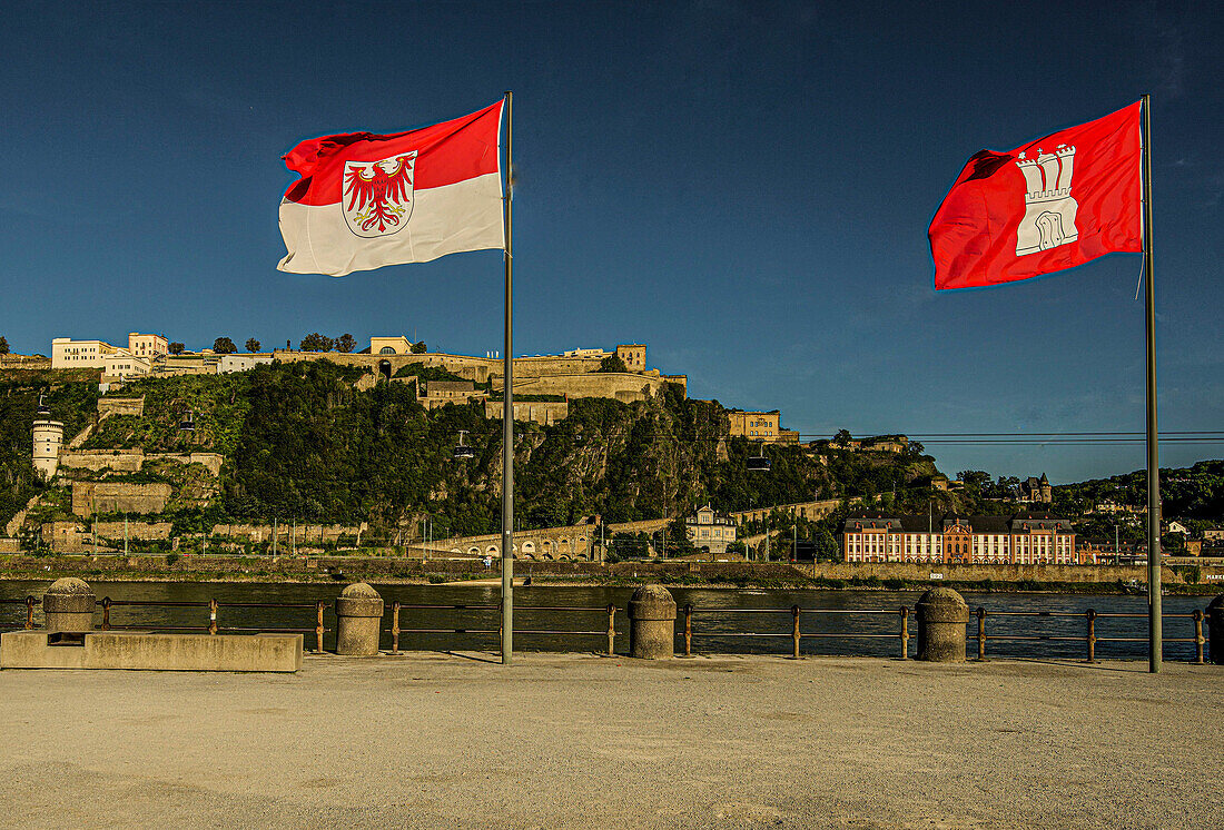 Flags of the federal states at the Deutsches Eck, view across the Rhine to Ehrenbreitstein Fortress, Koblenz, Upper Middle Rhine Valley, Rhineland-Palatinate, Germany