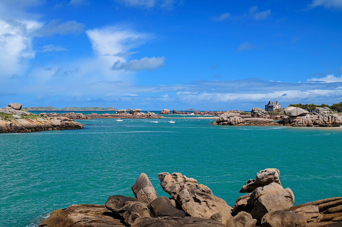 Rocky coves on the coast with boats and house, Trégastel, Côte de Granit Rose, Brittany, France