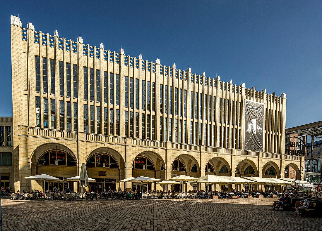 Facade of the Galerie Roter Turm shopping center by architect Hans Kollhoff (2000) with outdoor dining in the city center of Chemnitz, Saxony, Germany