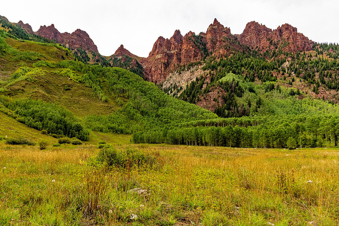 Aspens and red cliffs around Maroon Lake in Aspen Colorado