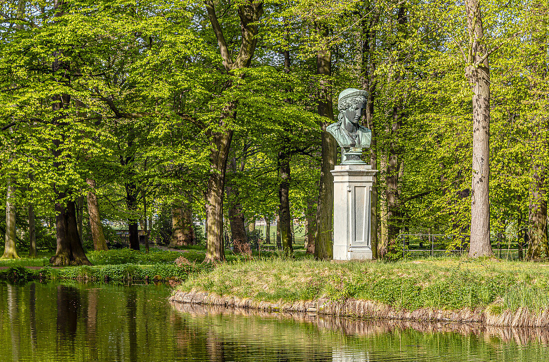 Bust on the island in Pillnitz Castle Park in spring, Dresden, Saxony, Germany