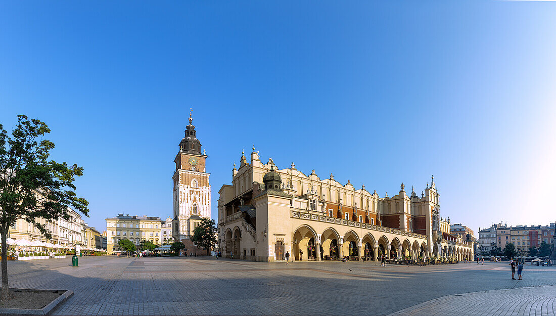 Rynek Glówny with Cloth Hall (Sukienice) and Town Hall Tower in the morning light in the old town of Kraków in Poland