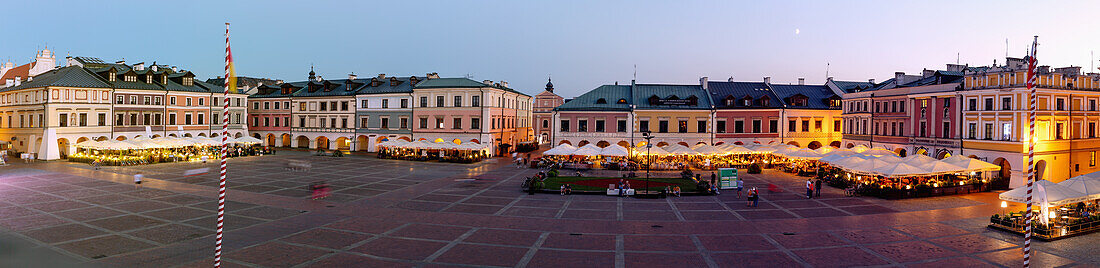 Rynek Wielki with street cafes and restaurants in the evening light in Zamość in Lubelskie Voivodeship of Poland
