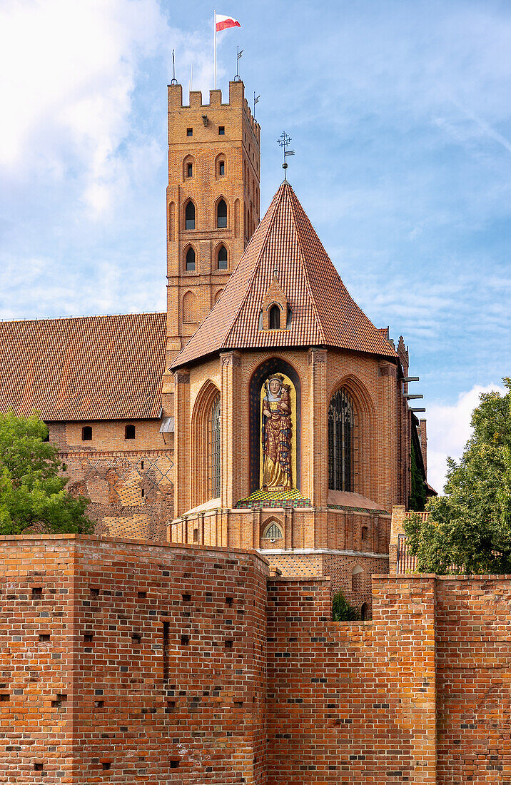 St. Mary's Church of St. Mary's Castle (Zamek w Malborku) with monumental figure of the Virgin Mary in Malbork in the Pomorskie Voivodeship of Poland