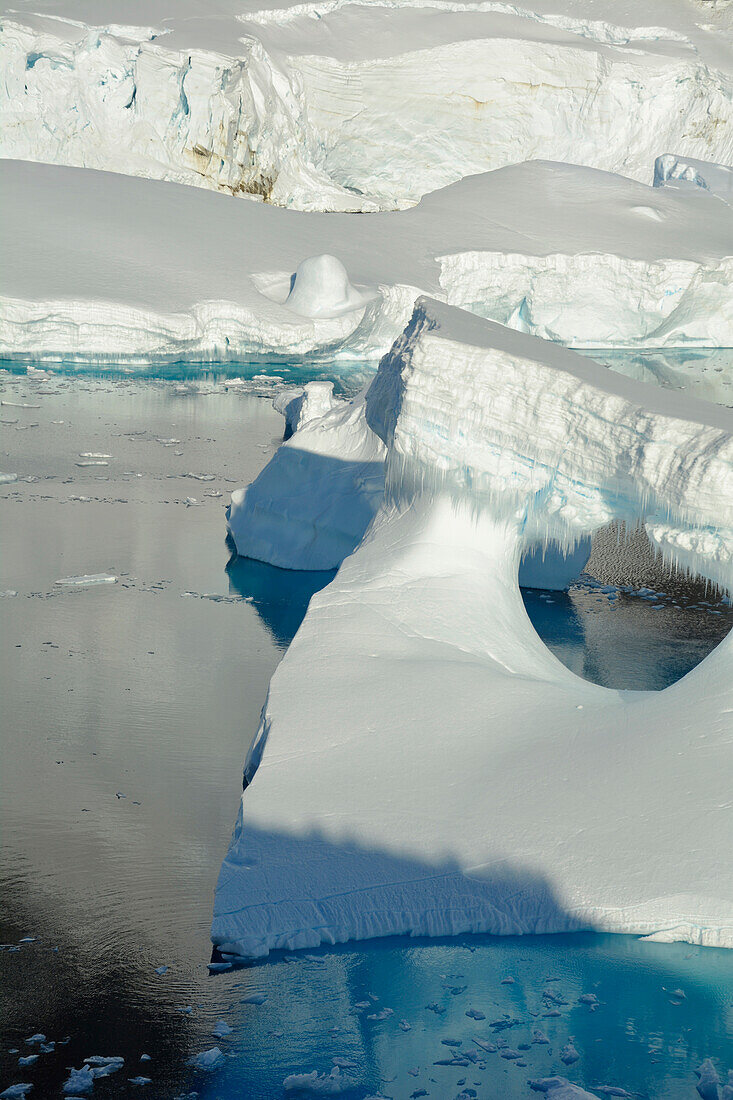 Antarctic; Antarctic Peninsula; Lemaire Channel; Icebergs are floating in the straits; in the background glaciers