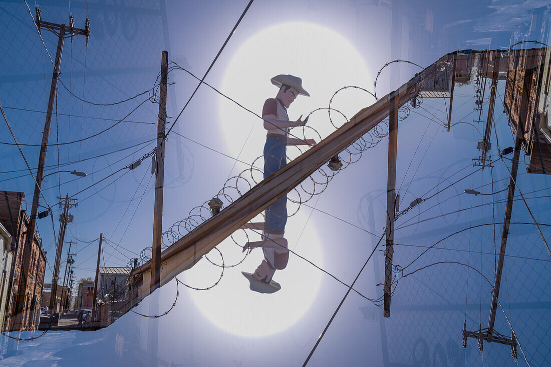 Double exposure of a huge cowboy statue as eyecather for a car salescompany in Gallup, New Mexico.