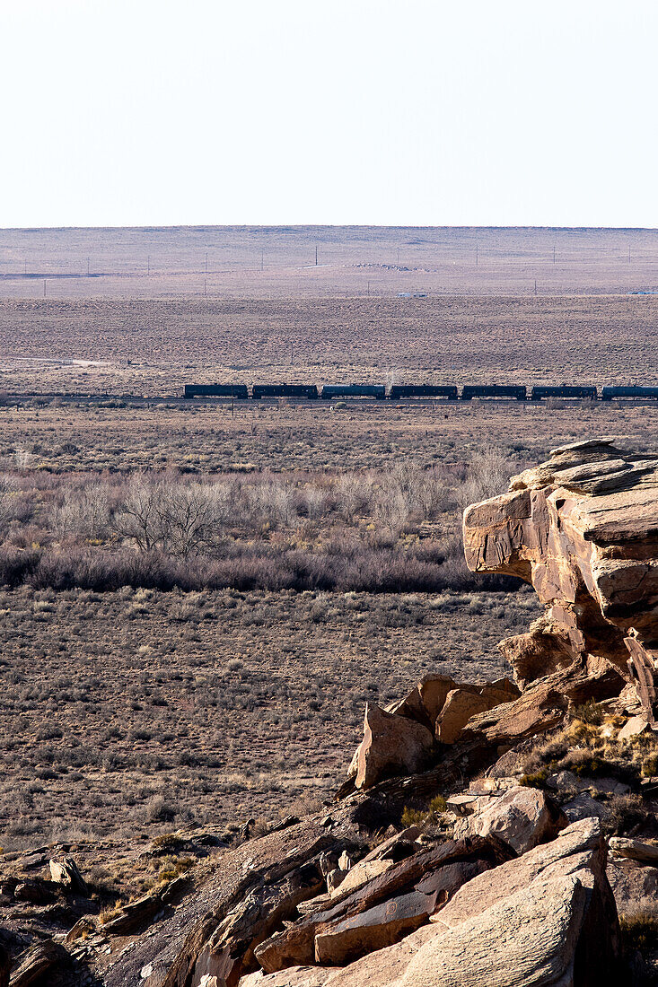 Freight train in the distance in the Arizona desert.