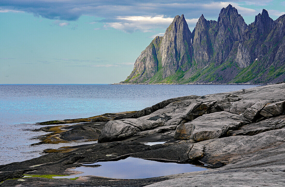 Norway, Senja Island, view from Tungeneset rest area, mountain peaks named &quot;Devil's Teeth&quot;.