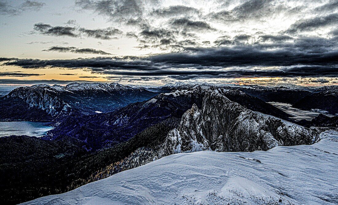 Winter mood in the Alps, sunrise on Schafberg and over the mountains of the Salzkammergut, Austria