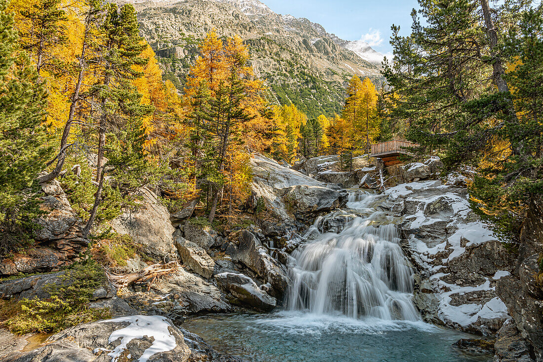 Cascada da Bernina waterfall on the Morteratsch glacier in autumn, Engadin, Graubünden, Switzerland