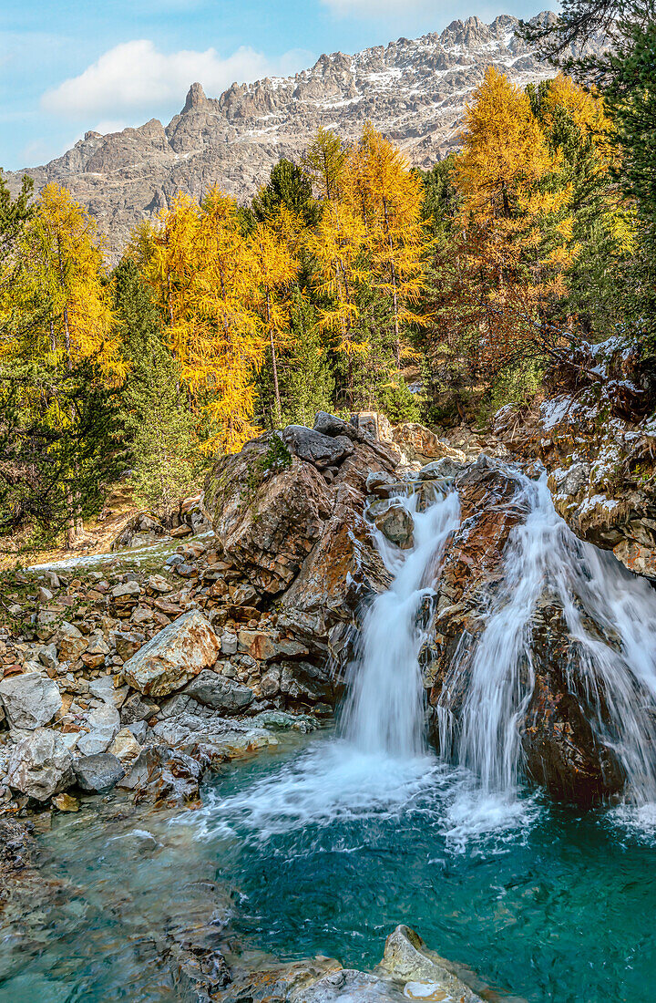Cascada da Bernina waterfall on the Morteratsch glacier in autumn, Engadin, Graubünden, Switzerland