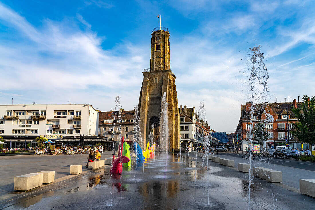 The Tour du Guet watchtower and fountain in the Places d'Armes square in Calais, France