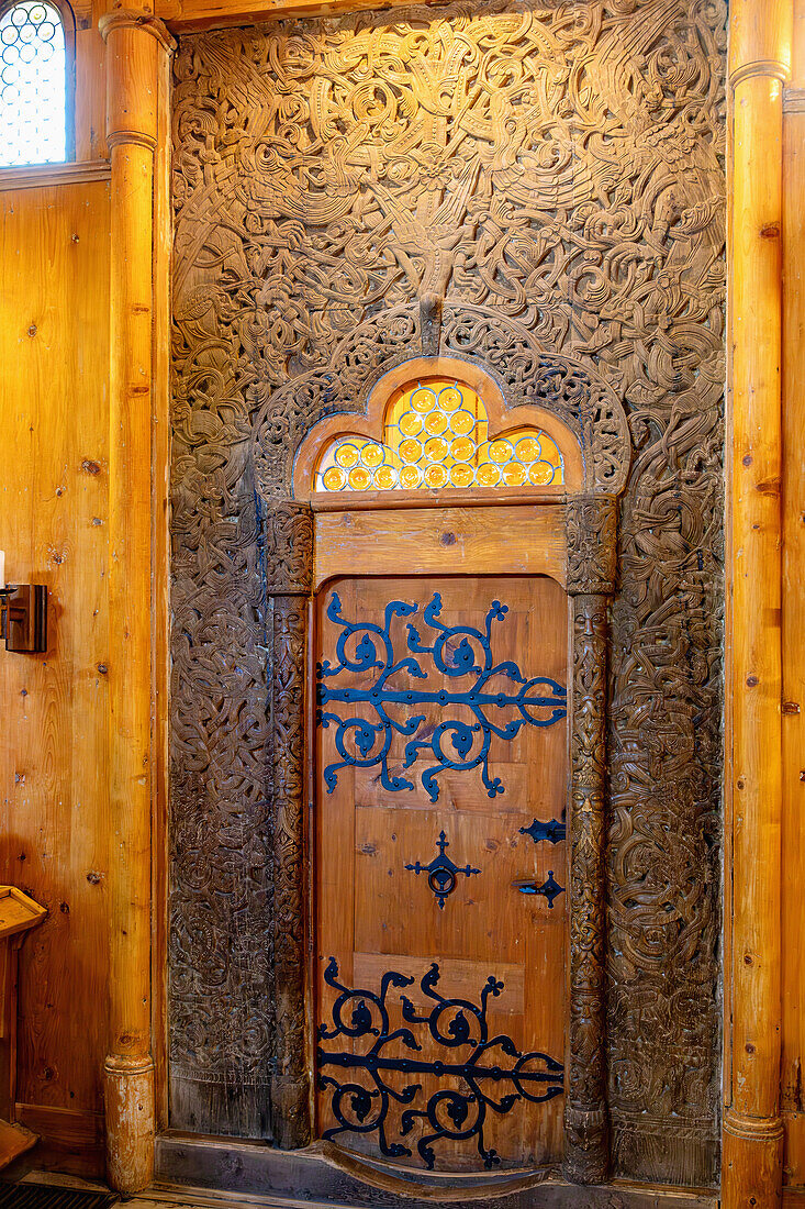 Wooden door decorated with carved motifs, Norwegian wooden stick church Wang (Wang Church, Kościół Wang, Kosciolek Wang) in Karpacz (Krummhübel) in the Giant Mountains (Krkonoše National Park; Karkonoski Park Narodowy) in the Dolnośląskie Voivodeship of Poland