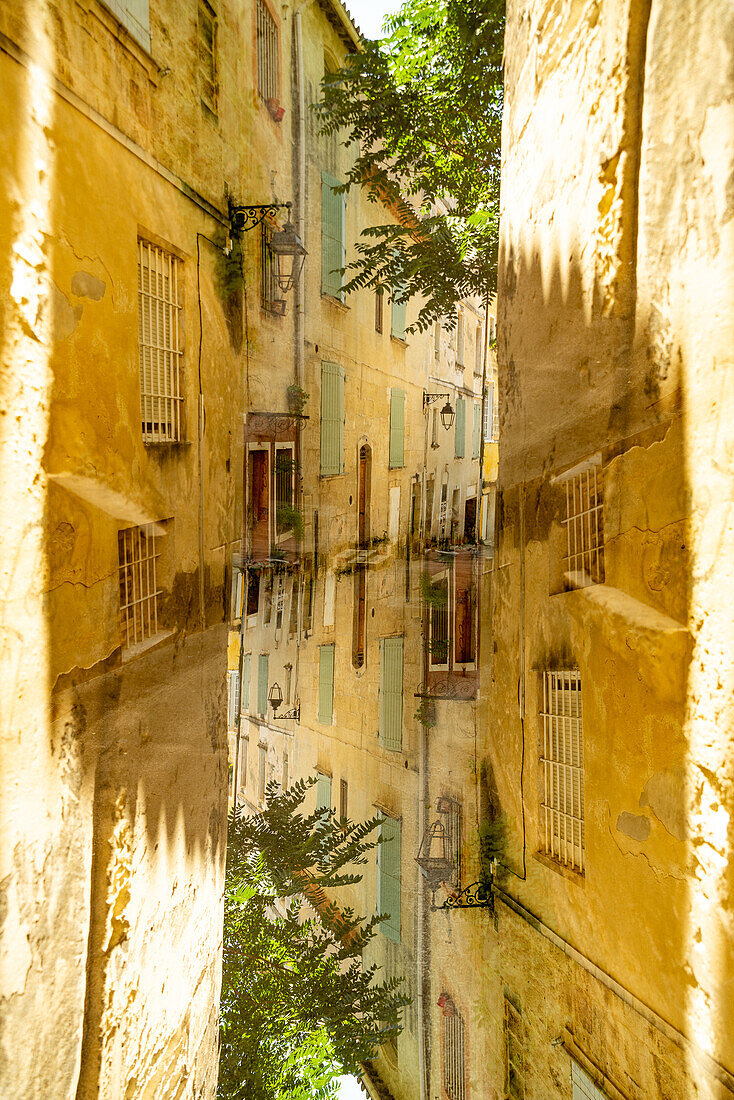 Double exposure of a medieval house in Arles, France.