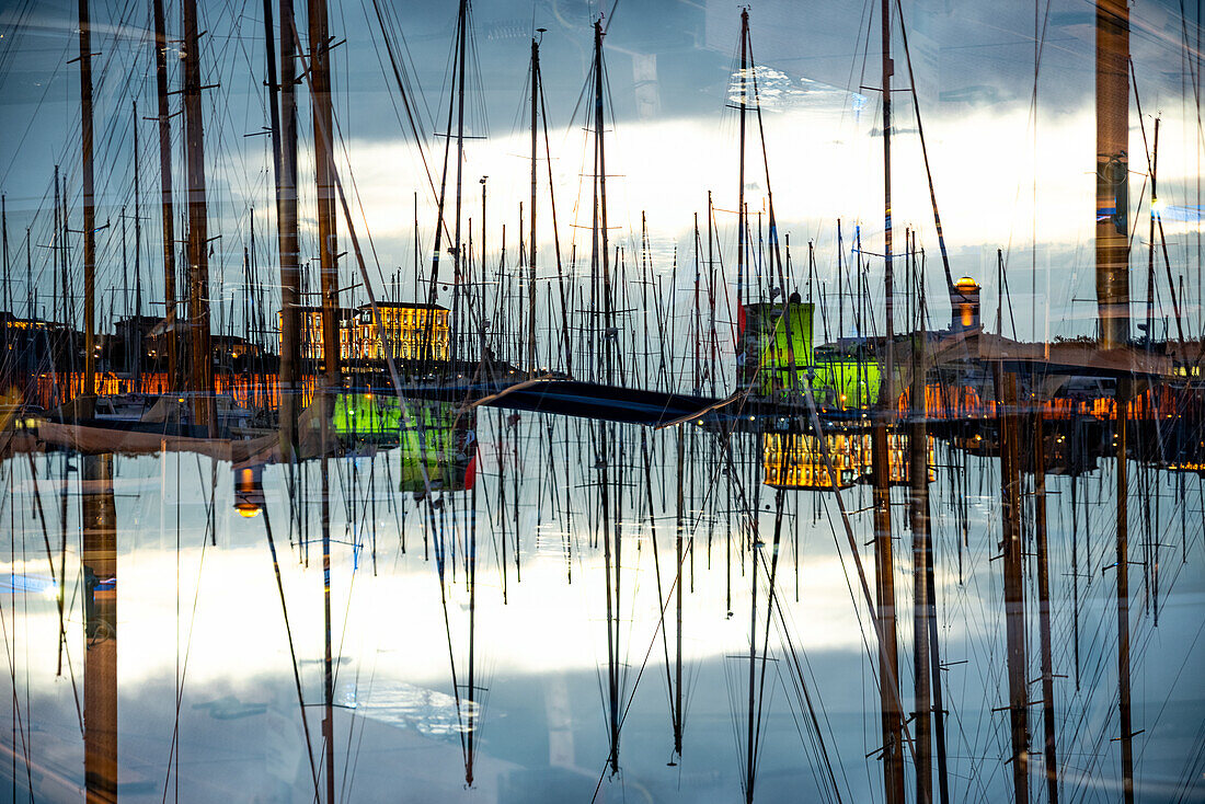 Double exposure of the yacht harbour of Marseille by  the twilight of dusk.