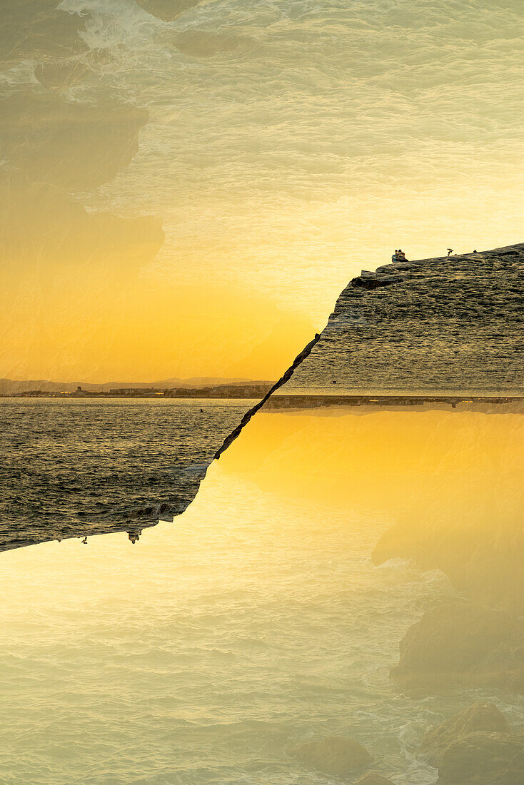 Double exposure of the rocky coast and Mediterranean sea in Nice, France.