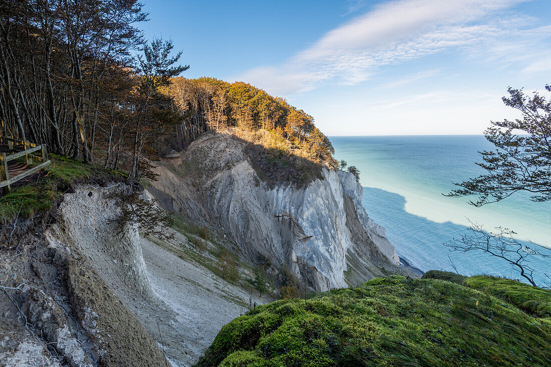 Steep coast of Møns Klint, chalk cliffs, white water of the Baltic Sea through washed-out chalk after storm surge, Mön Island, Denmark