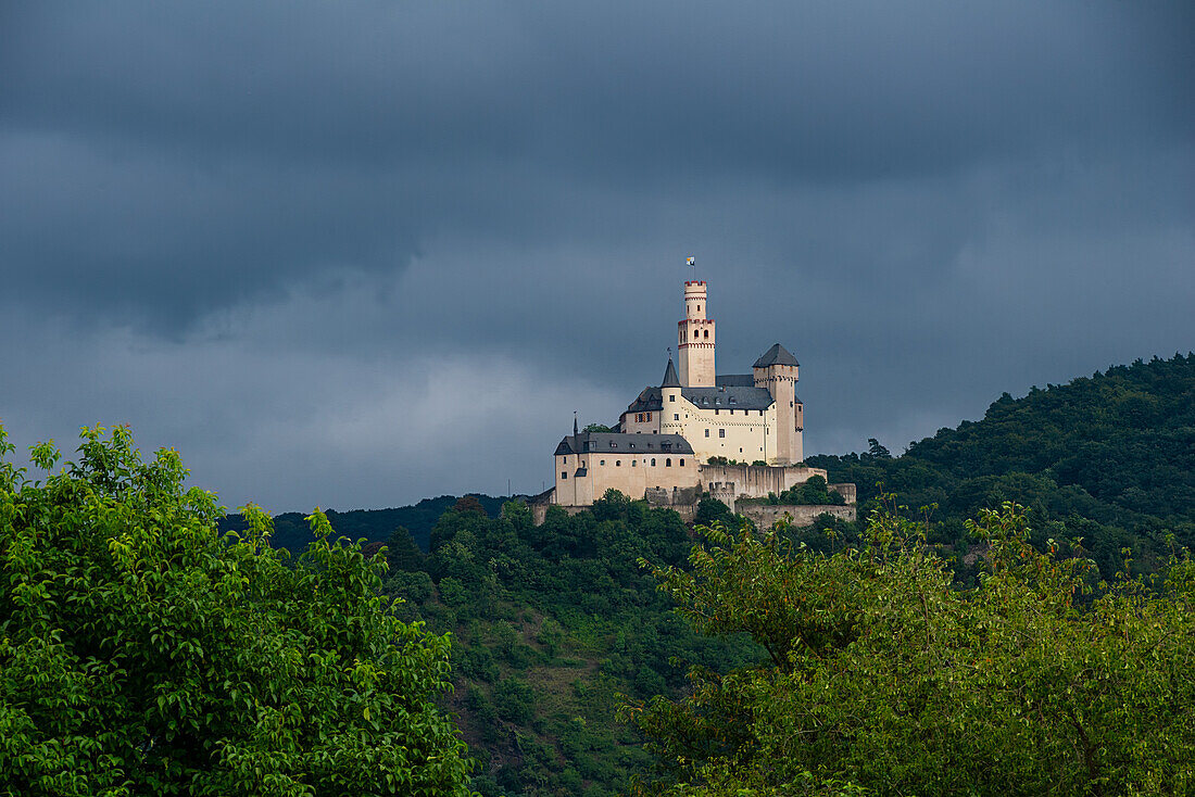 The Marksburg near Braubach, headquarters of the German Castle Association, in front of a gloomy sky, UNESCO World Heritage Site, Rhineland-Palatinate, Germany