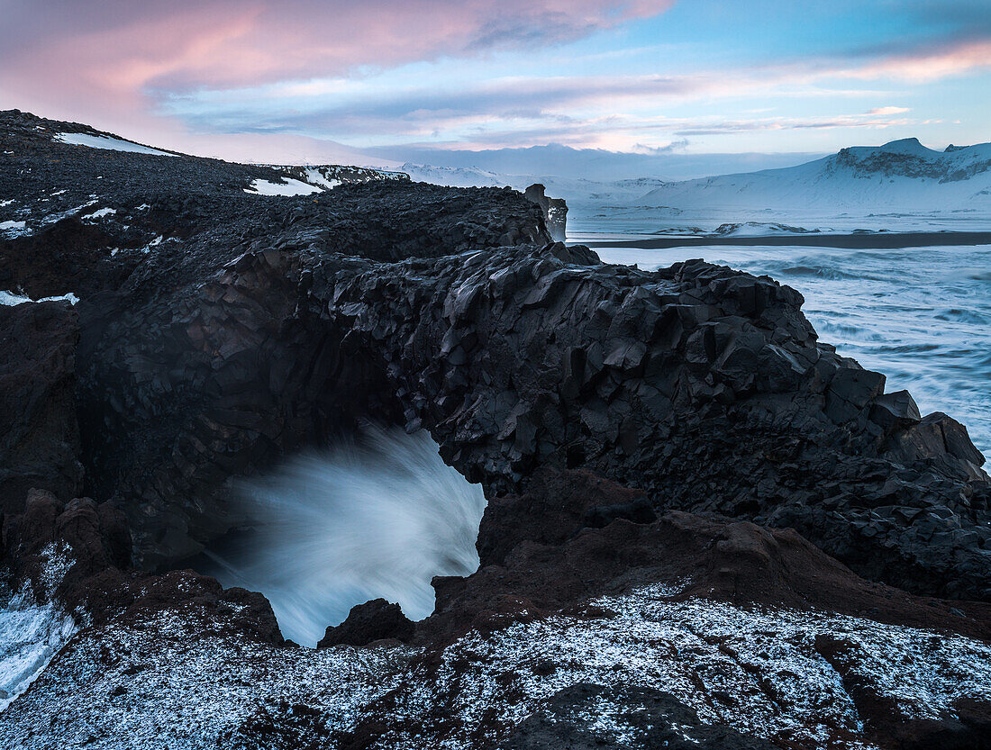 Rock arch at dusk, Iceland