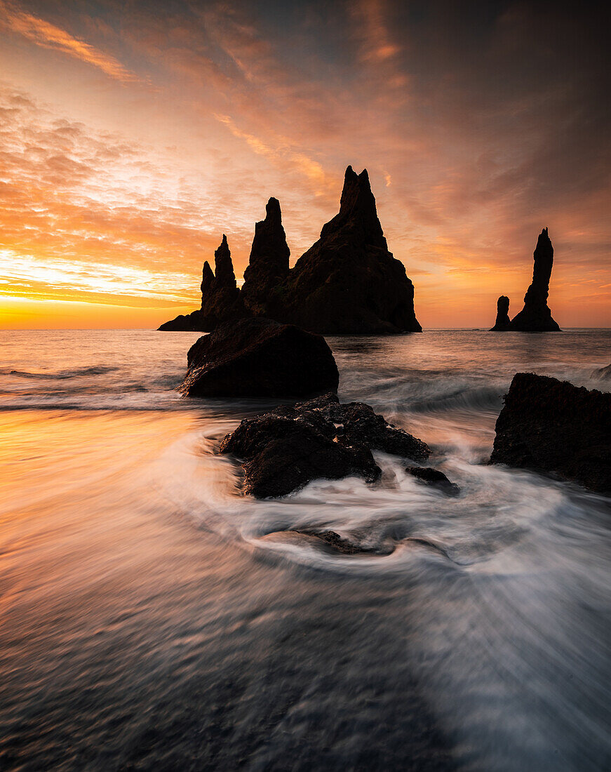 Rock pinnacles at sunrise on Black Sand Beach, Iceland