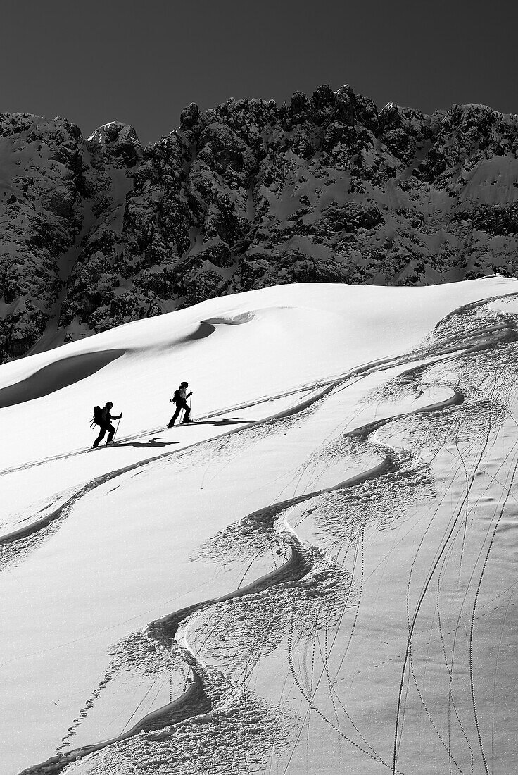 Two people on a ski tour climb up to the Tajatörl, Tajatörl, Mieming Mountains, Tyrol, Austria