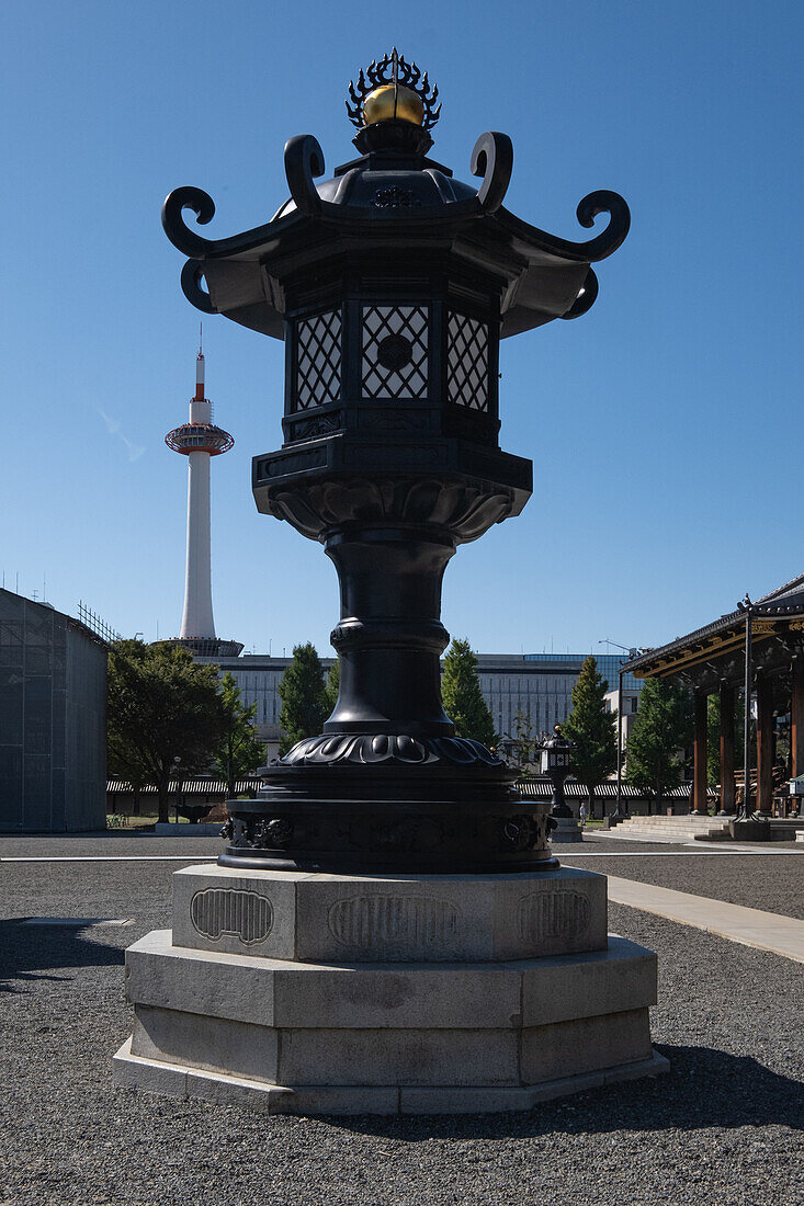  Lantern in front of the Higashi-Honganji Temple, in the background the observation tower Kyoto tower, r ,Higashi-Honganji Temple during the day, Kyoto, Japan, Asia 