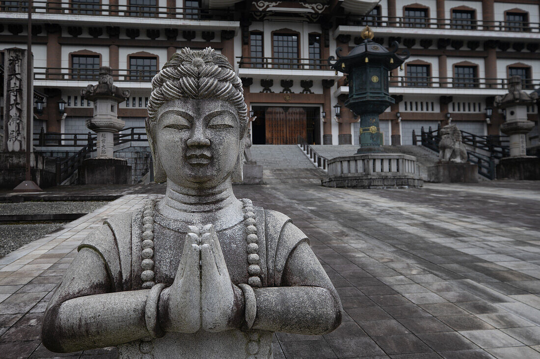  Praying statue in the Gojyu no To pagoda in Seida-ji Temple, Daishi Mountain, Katsuyama, Okuetsu, Fukui, Japan, Asia  