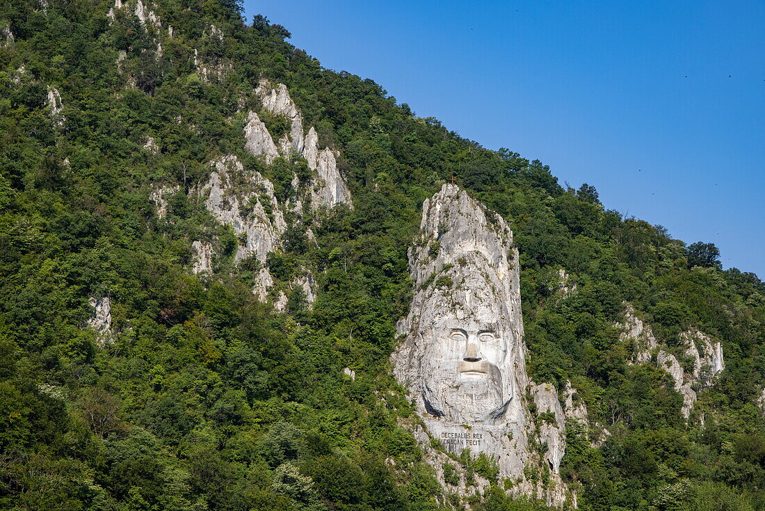 The 40 m high rock sculpture of Decebalus in the Iron Gates Gorge on the Danube, near Drobeta Turnu-Severin, Mehedinți, Romania, Europe