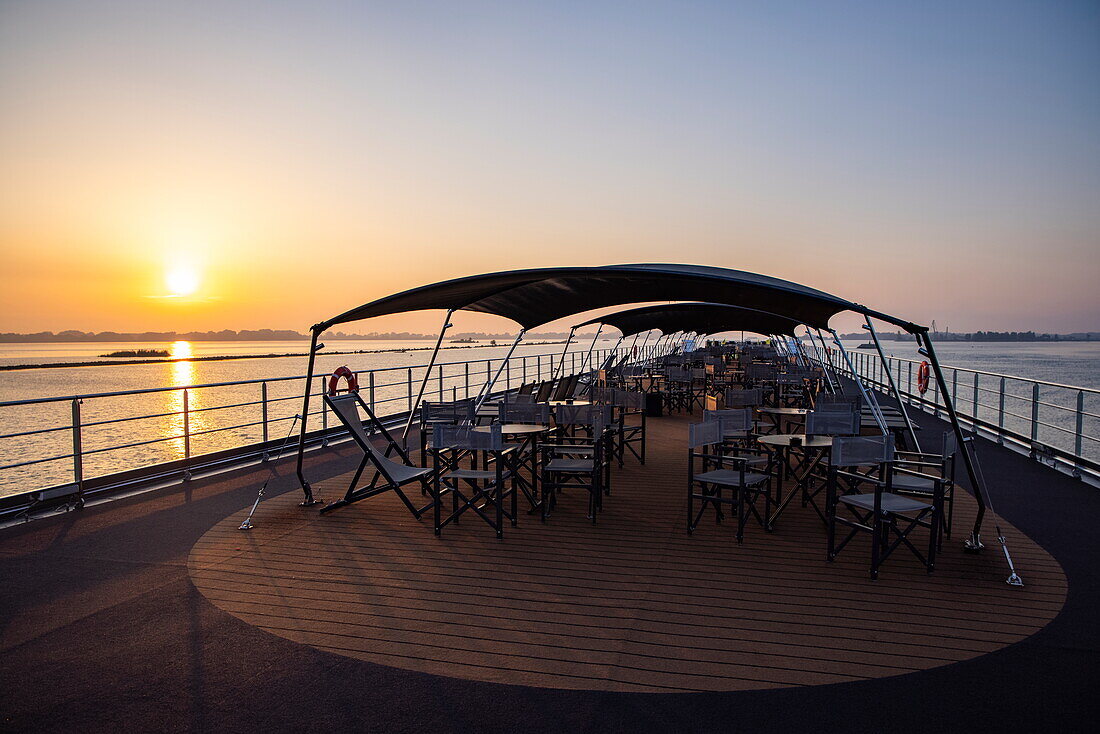 Deck of river cruise ship NickoVISION (Nicko Cruises) on the Danube at sunrise, near Bratislava, Bratislava, Slovakia, Europe