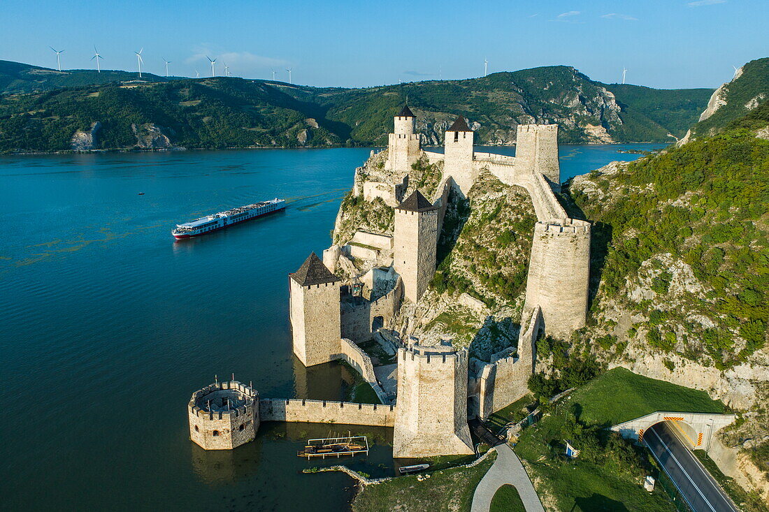 Aerial view of Golubac Fortress in the Iron Gates Gorge of the Danube with the river cruise ship Maxima (niko cruises), Golubac, Caraș-Severin, Romania, Europe