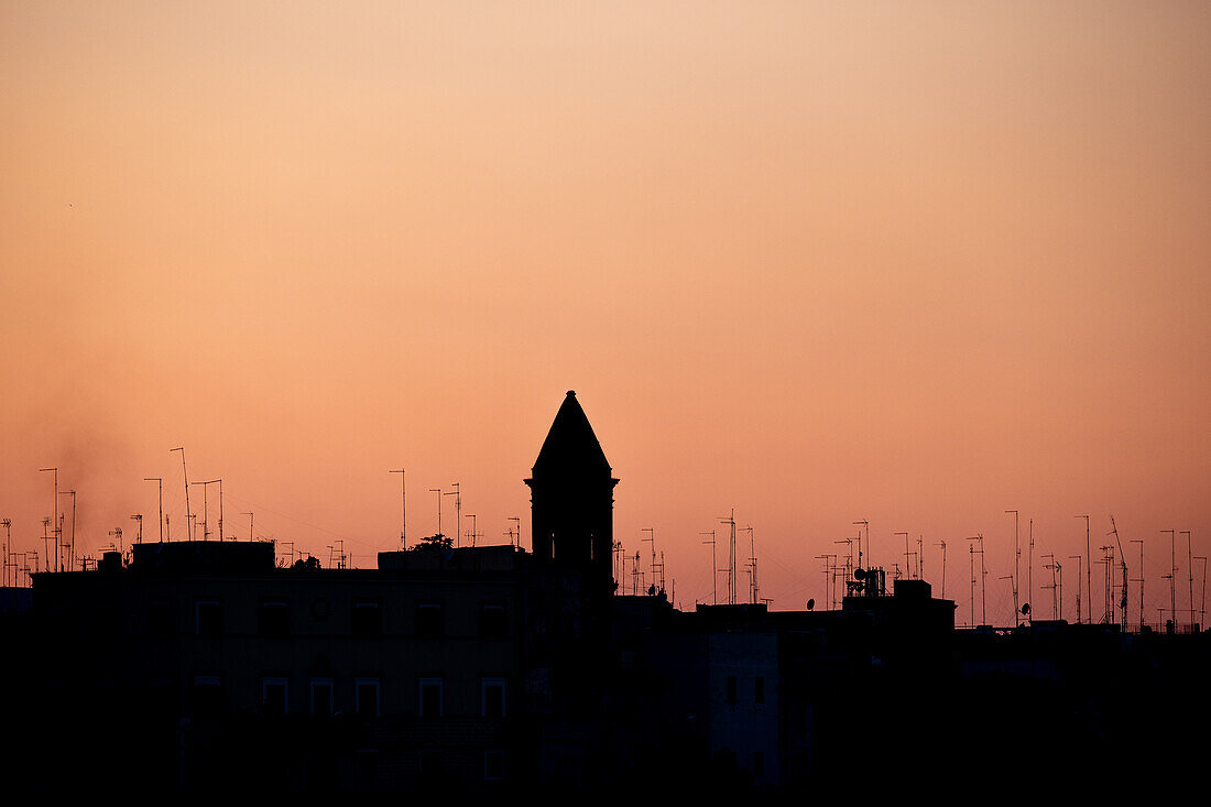 Roofs with antennas backlit at sunset, Bari, Bari, Apulia, Italy, Europe