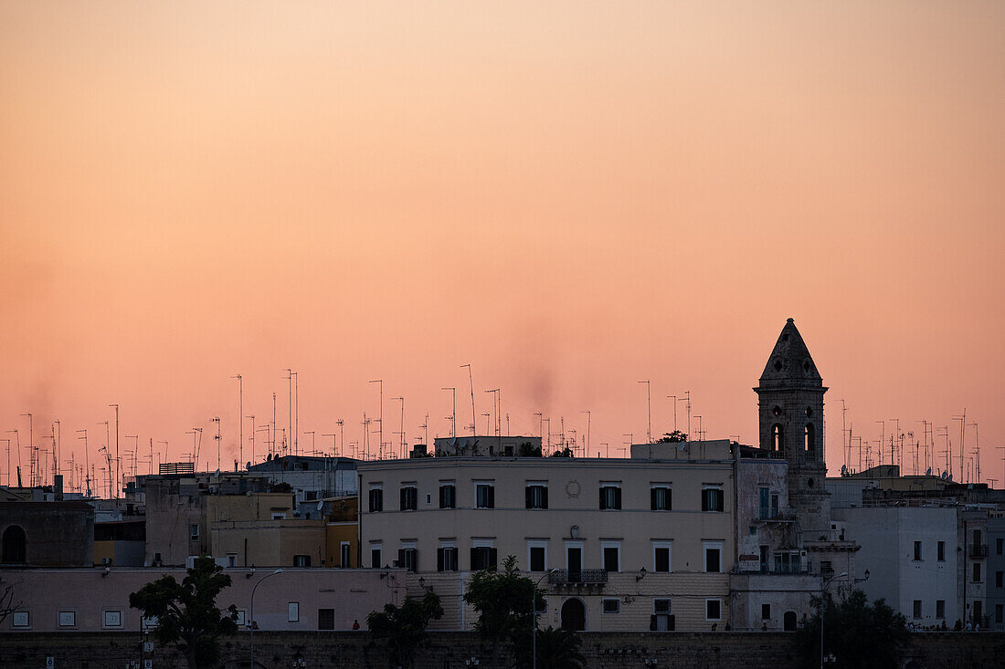 Roofs with antennas backlit at sunset, Bari, Bari, Apulia, Italy, Europe