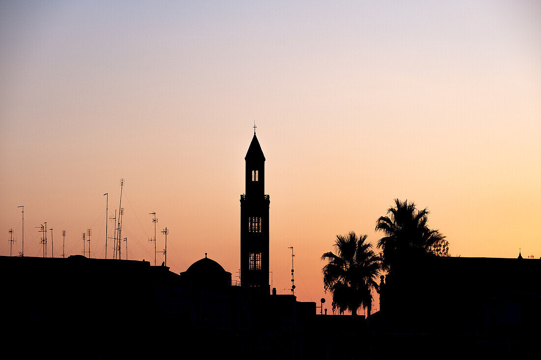 View of the church tower of the San Sabino Cathedral backlit at sunset, Bari, Apulia, Italy, Europe