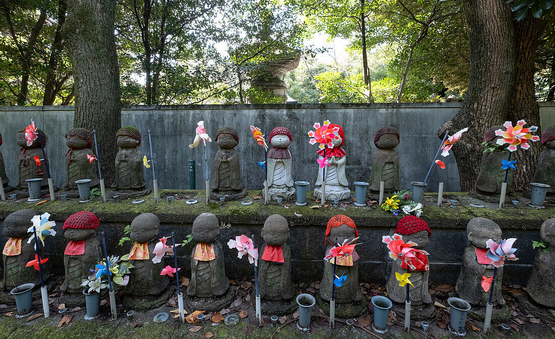 View of Jizo statues (Kosodate Jizo-son) guardian deity of children, Zojoji Temple, Tokyo, Japan, Asia