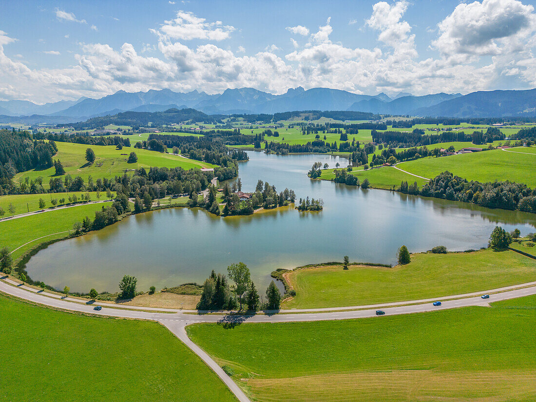 Aerial view of the Schwaltenweiher near Seeg im Allgäu against Allgäu Alps, Ostallgäu, Swabia, Alps, Prealps, Bavarian Alps, Allgäu, Swabia, Upper Swabia, Northern Limestone Alps, Bavaria, Germany