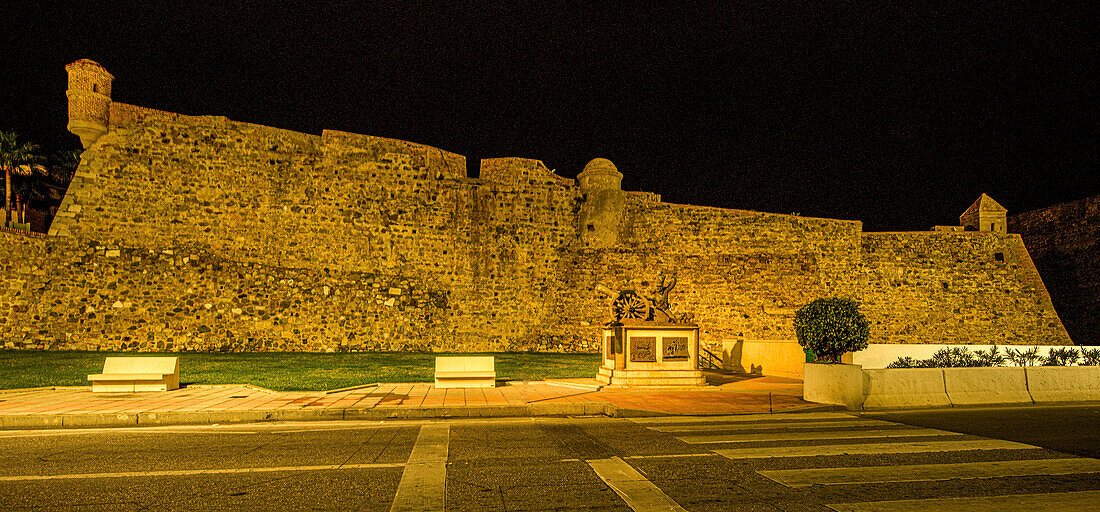  Murallas Reales fortification on the seafront of Ceuta at night, Strait of Gibraltar, Spain 
