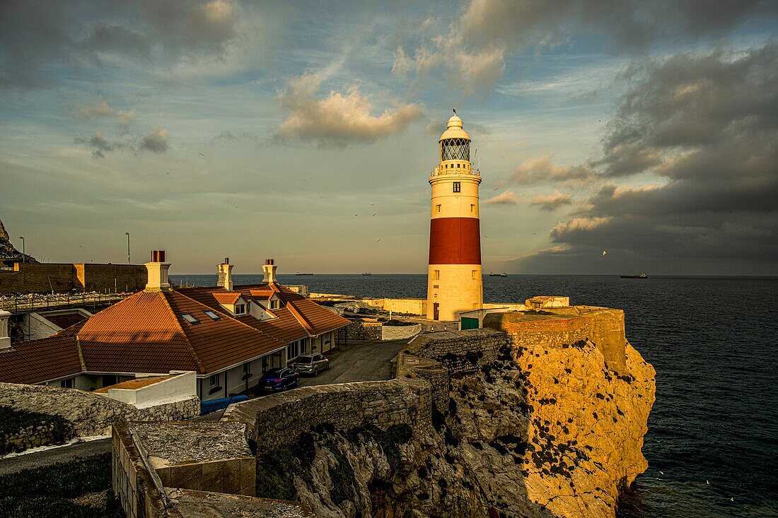  Europa Point in the evening light, lighthouse on the rocky cliff above the sea, Gibraltar British Crown Colony 
