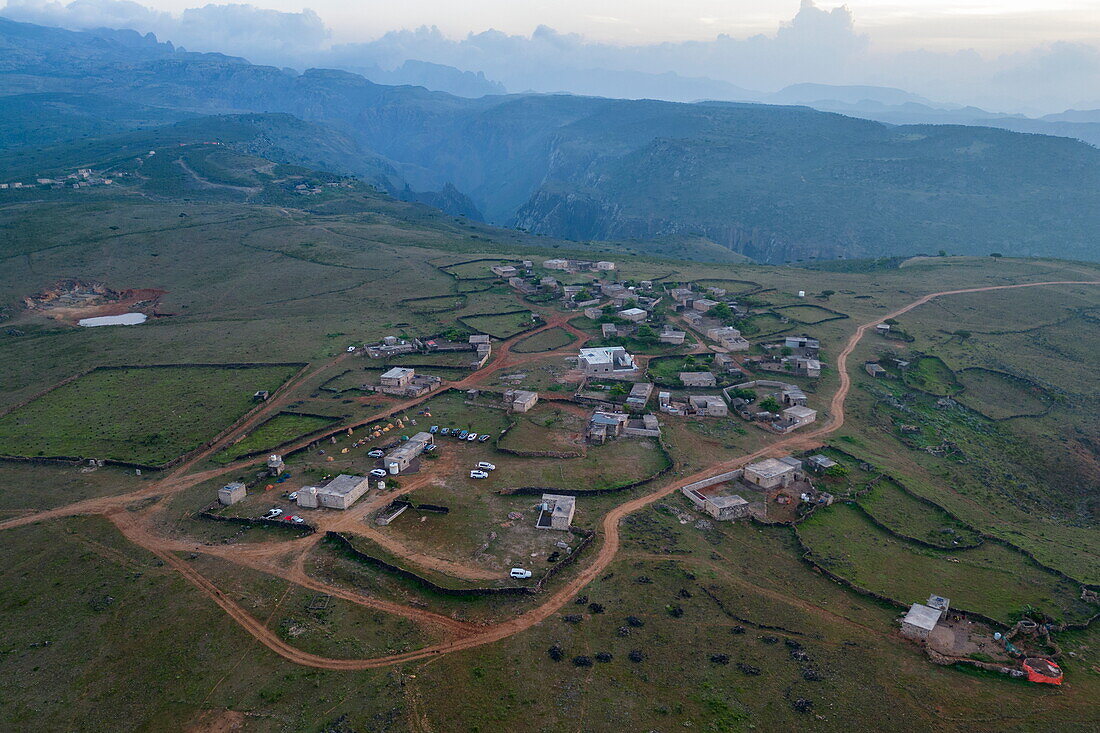  Aerial view of village on Diksam Plateau with Wadi Dirhur Canyon behind, Gallaba, Socotra Island, Yemen, Middle East 