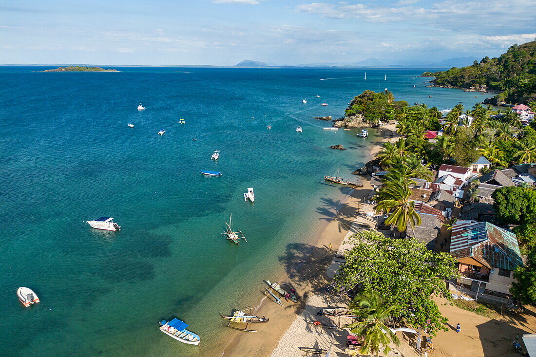  Aerial view of boats, beach and village, Nosy Komba, Diana, Madagascar, Indian Ocean 
