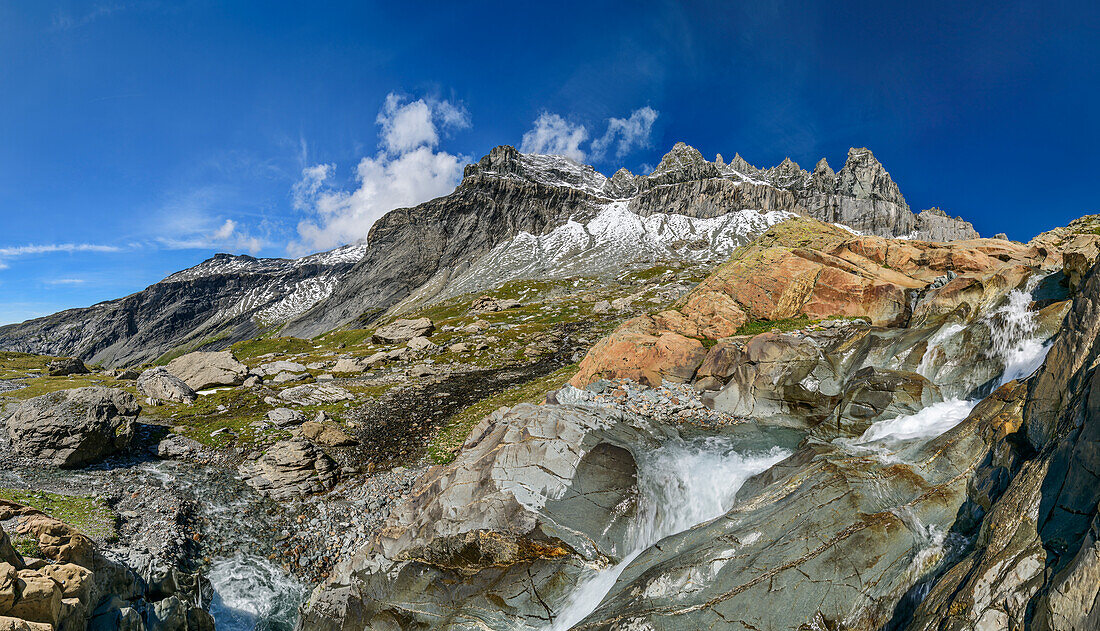  Panorama with waterfall flowing over red rock slabs, Tschingelhörner in the background, Plaun Segnas Sut, Unterer Segnesboden, Sardona Tectonic Arena, Glarus Main Thrust, UNESCO World Natural Heritage Glarus Alps, Glarus Alps, Graubünden, Switzerland  