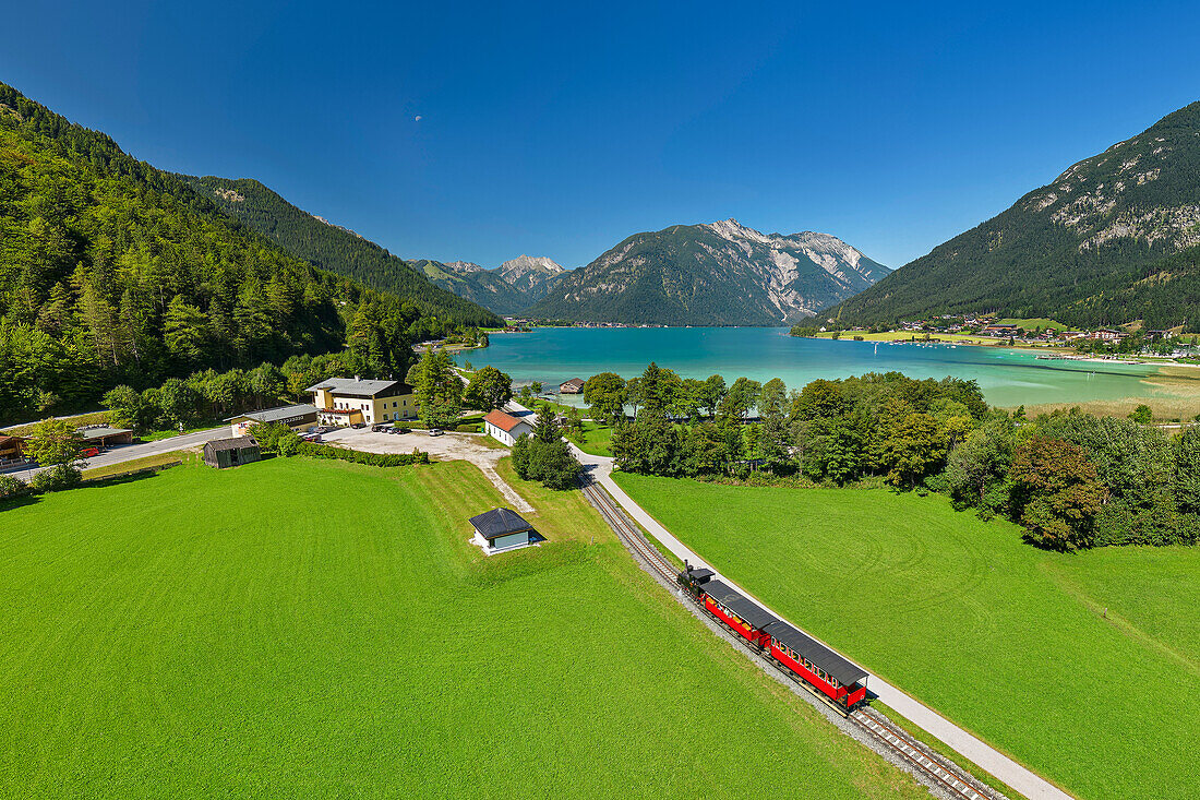  Steam locomotive of the Achenseebahn approaches Achensee, Karwendel in the background, Achensee, Tyrol, Austria 