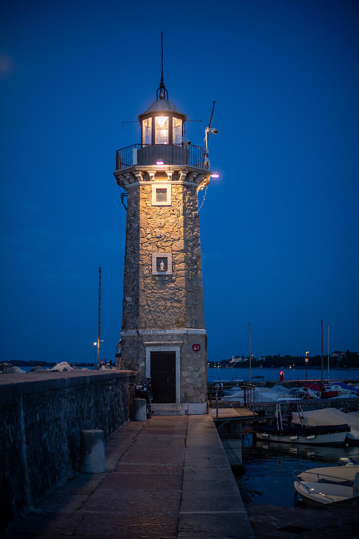  The lighthouse of Desenzano del Garda in the evening, Lake Garda, Italy 
