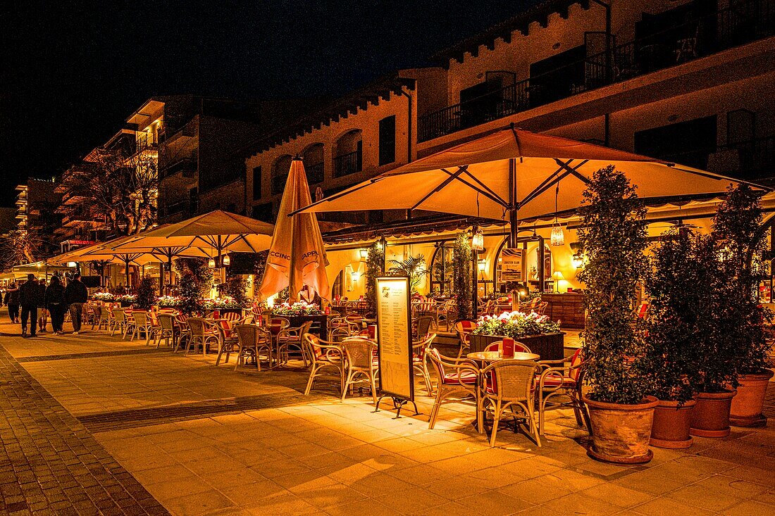  Evening atmosphere on the sea promenade of Port de Pollenca, Mallorca, Spain 