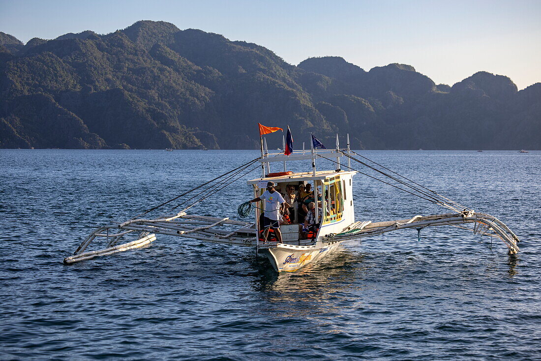  Bangka outrigger canoe tour boat and coast, Coron, Palawan, Philippines 