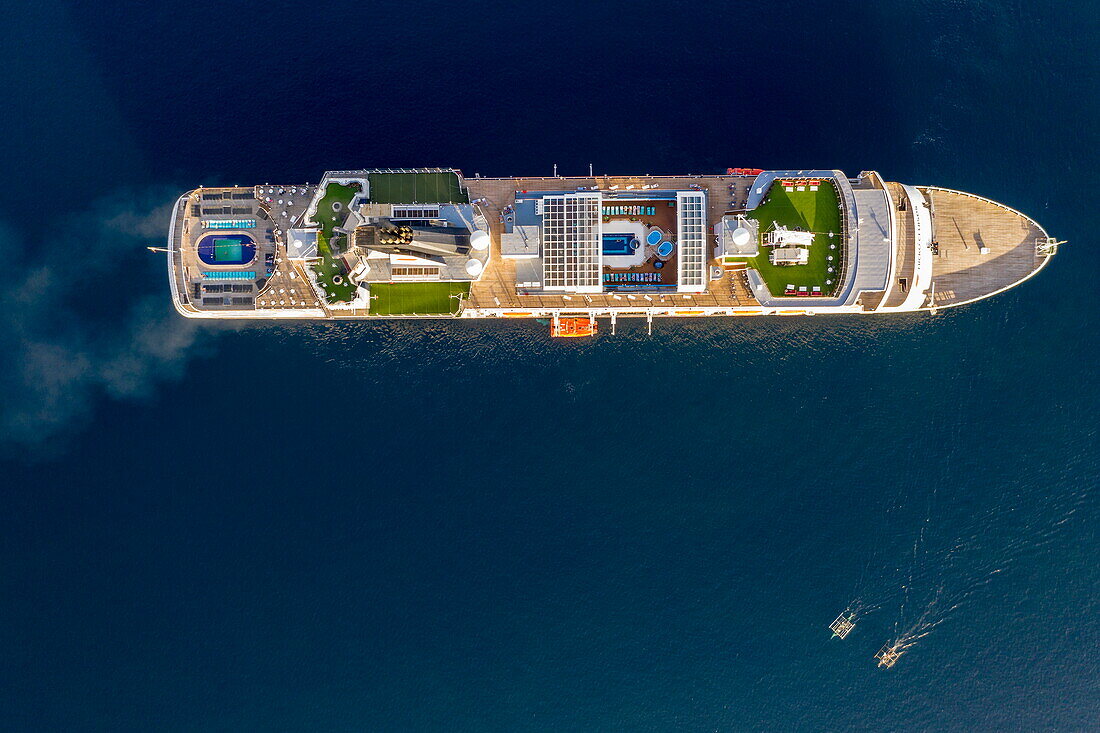  Aerial view of cruise ship Vasco da Gama (nicko cruises) with traditional Bangka outrigger canoe fishing boats, Tagbilaran, Bohol, Philippines 