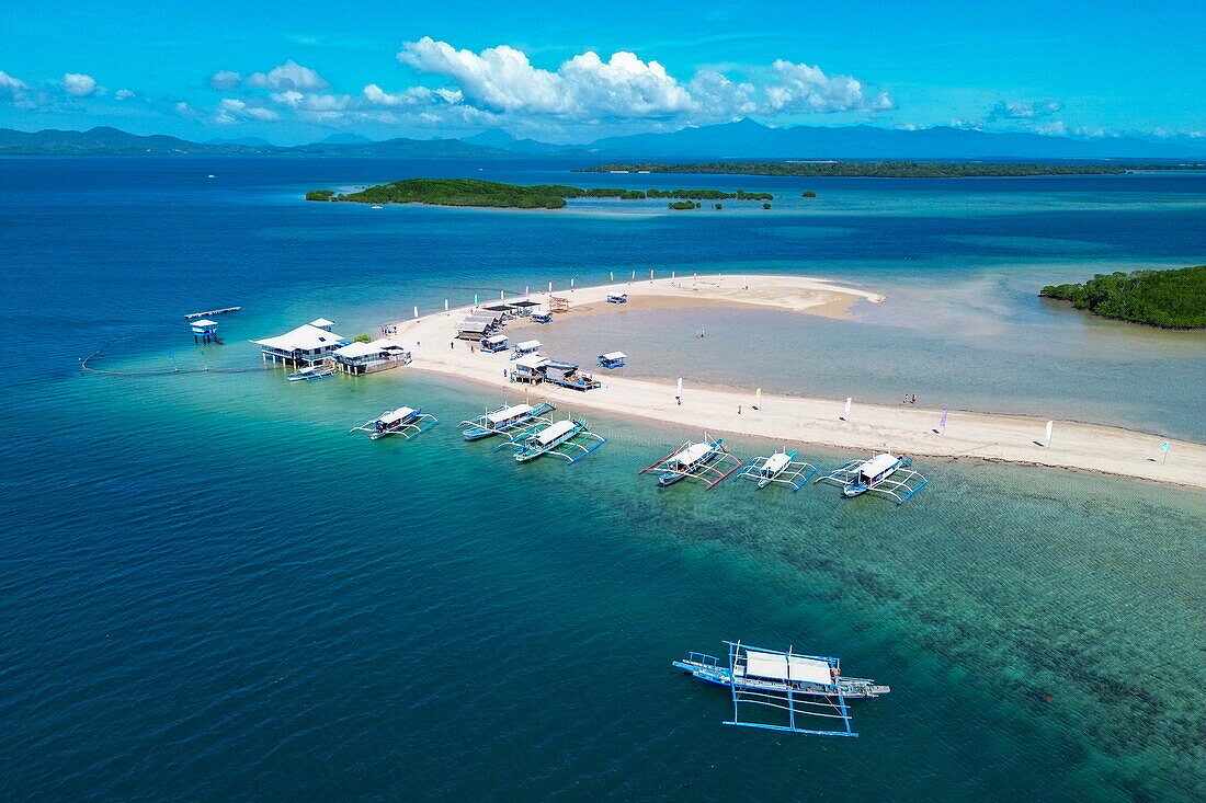  Aerial view of sandbar and Bangka outrigger canoe tour boats on Luli Island, Honda Bay, near Puerto Princesa, Palawan, Philippines 